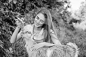 Woman and small goat green grass. Veterinarian occupation. Eco farm. Love and care. Animals law. Farm and farming