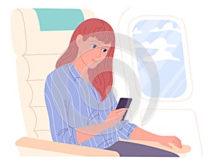 Woman with smartphone on aircraft during flight