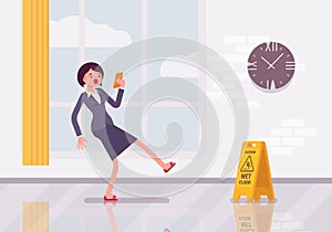 Woman with a smartphone slipps on the wet floor