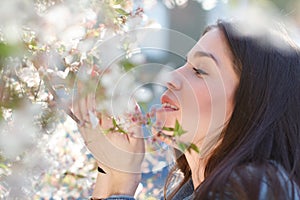 Woman smell cherry tree flower