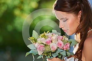 Woman, smell and wedding rose bouquet with love, commitment and trust ceremony for marriage. Engagement, celebration and