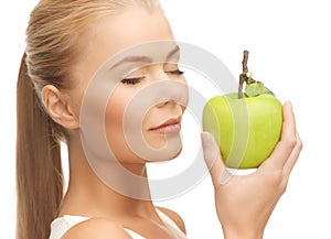 Woman smelling apple