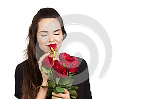 Woman smelling bunch of roses