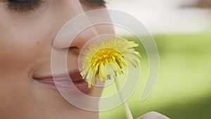 Woman Smelling Dandelion Enjoying Summer Day Outdoors, Cropped
