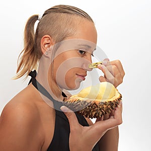 Woman smelling durian