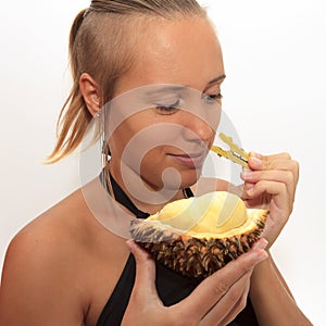 Woman smelling durian