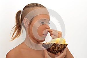 Woman smelling durian