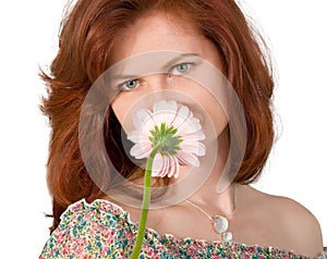 Woman smelling a flower