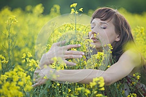 Woman smelling flowers