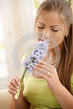 Woman smelling flowers