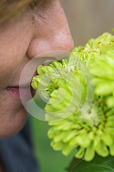 Woman smelling flowers