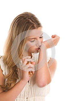 Woman smelling perfume