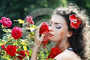 Woman smelling red roses