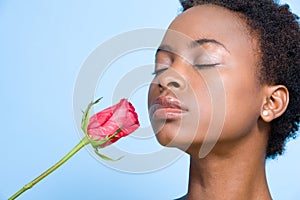 Woman smelling rose