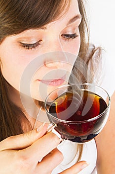 Woman smelling tea