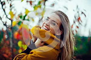 Woman smile in autumn with leaves