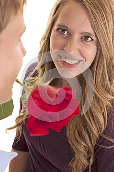 Woman smile man rose in mouth