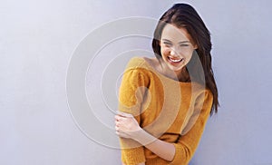 Woman, smile and mockup with fashion, laugh and smile with sweater for comfort. Model, happy and positive with natural