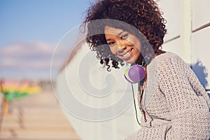 Woman, smile and portrait in city for travel, walk and break in urban for summer, fun and outdoor. African person and