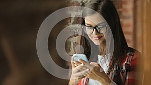 Woman smiles as reading message