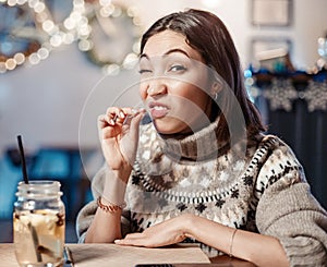 Woman smiles, winks and picks her teeth with a toothpick on a first date. Concept of bad manners and bad habits, as well as