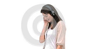 Woman smiling at the camera while shes listening to music