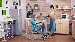 Woman smiling at disabled husband