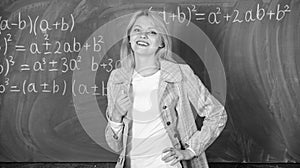 Woman smiling educator classroom chalkboard background. Working conditions which prospective teachers must consider