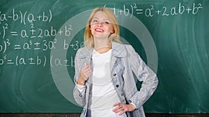 Woman smiling educator classroom chalkboard background. Working conditions which prospective teachers must consider