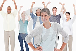 Woman smiling with her hands on her hips