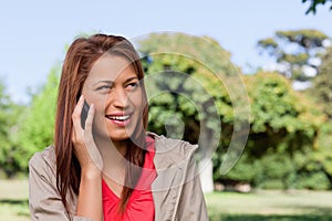 Woman smiling while looking towards her left side