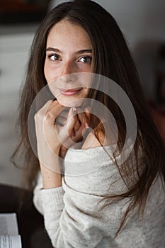 Woman smiling with perfect smile and white teeth in a park and looking at camera