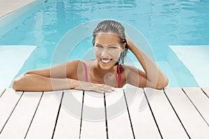 Woman Smiling At Poolside