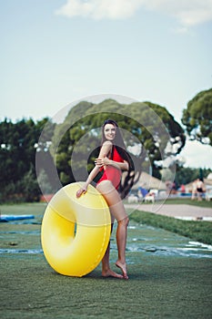 Woman smiling posing in a swimsuit