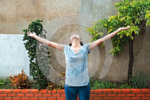 A woman smiling in the rain