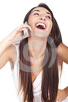 Woman smiling and speaking at her celular photo