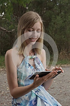 Woman smiling with tablet