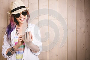 Woman smiling while using mobile phone