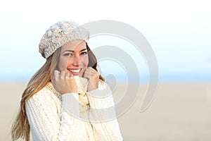 Woman smiling warmly clothed in winter photo