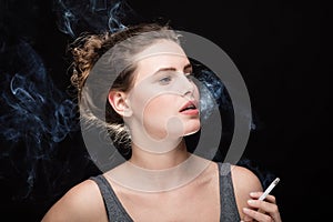 Woman smoking concept on black