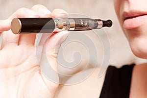 Woman smoking with electronic cigarette