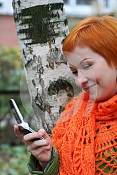 Woman is sms in mobile-phone