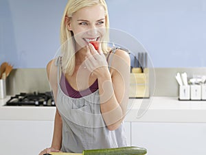 Woman Snacking On Cherry Tomato