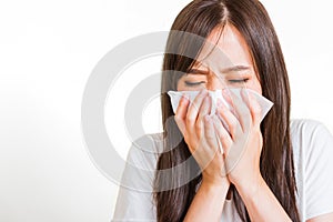 Woman sneezing sinus using towel to wipe snot from nose