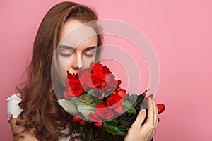 Woman sniffing flowers