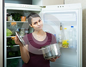 Woman sniffing at foul food