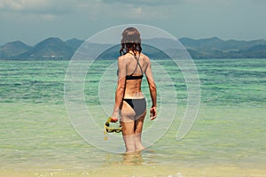 Woman with snorkel on the beach