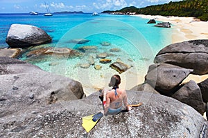 Woman with snorkeling equipment at tropical beach