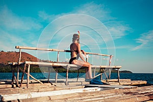 Woman in snorkeling gear on raft