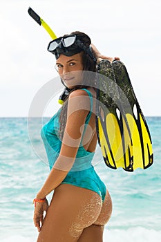 Woman during snorkeling on the sandy beach